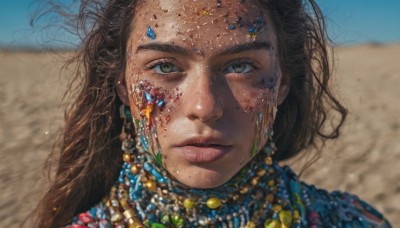 1girl,solo,long hair,looking at viewer,brown hair,brown eyes,jewelry,closed mouth,outdoors,sky,day,dark skin,necklace,mole,blurry,dark-skinned female,blue sky,lips,blood,depth of field,blurry background,expressionless,messy hair,gem,portrait,freckles,blood on face,realistic,nose,sand,dirty,gold,desert,dirty face,head chain,black hair,earrings,eyelashes,wind,close-up,serious