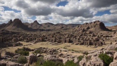 outdoors,sky,day,cloud,tree,blue sky,no humans,cloudy sky,grass,building,nature,scenery,rock,mountain,river,landscape,cliff,sand,ruins