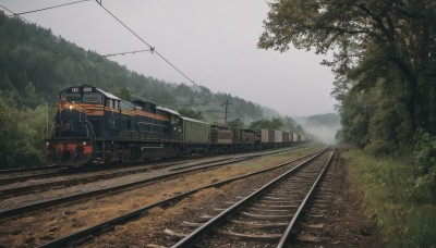 outdoors,sky,day,cloud,tree,no humans,cloudy sky,grass,ground vehicle,nature,scenery,motor vehicle,forest,mountain,road,vehicle focus,power lines,utility pole,train,grey sky,railroad tracks