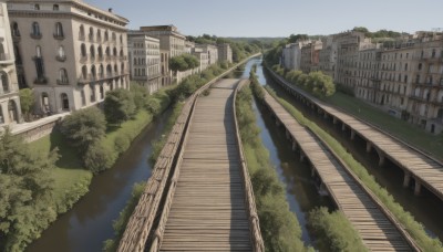 outdoors,sky,day,water,tree,blue sky,no humans,window,grass,plant,building,scenery,stairs,railing,road,house,bridge,river,railroad tracks,overgrown,real world location,cloud,city,bush,arch