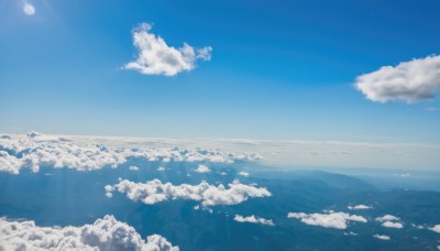 monochrome,outdoors,sky,day,cloud,blue sky,no humans,ocean,sunlight,cloudy sky,scenery,blue theme,mountain,sun,horizon,landscape,above clouds,water