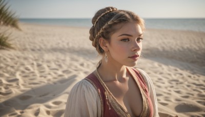 1girl,solo,breasts,looking at viewer,short hair,brown hair,dress,cleavage,brown eyes,jewelry,medium breasts,closed mouth,collarbone,upper body,braid,earrings,outdoors,day,necklace,hair bun,blurry,lips,depth of field,blurry background,beach,red dress,single hair bun,freckles,realistic,nose,sand,desert,blue eyes,water,makeup,ocean,sunlight,braided bun