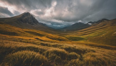 outdoors,sky,day,cloud,no humans,cloudy sky,grass,nature,scenery,mountain,field,landscape,mountainous horizon,hill