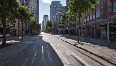 outdoors,sky,day,cloud,tree,blue sky,no humans,shadow,cloudy sky,ground vehicle,building,scenery,motor vehicle,city,sign,car,road,cityscape,lamppost,street,skyscraper,road sign,traffic light,crosswalk,real world location,sidewalk,window,bus