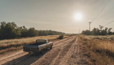 outdoors,sky,cloud,tree,no humans,grass,ground vehicle,nature,scenery,motor vehicle,forest,sunset,sun,car,road,vehicle focus,power lines,utility pole,realistic,bush,field,sports car