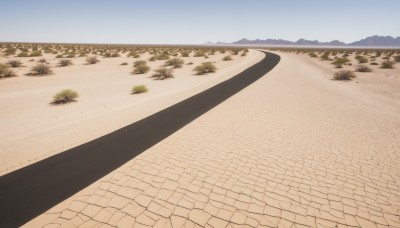 outdoors,sky,day,tree,blue sky,no humans,shadow,grass,nature,scenery,mountain,sand,road,landscape,path,hill,desert,cloud,water,ocean,beach,horizon,bush,river,shore