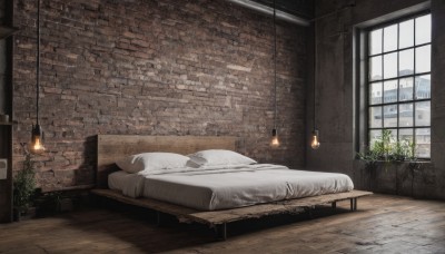 day,indoors,pillow,no humans,window,bed,table,plant,building,scenery,couch,blanket,potted plant,lamp,wall,brick wall,fireplace,lying,book,bed sheet,on bed,sleeping,curtains,wooden floor,door,candle,rug,brick