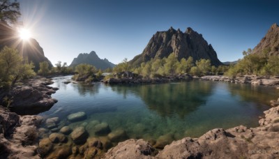 outdoors,sky,day,cloud,water,tree,blue sky,no humans,bird,sunlight,grass,nature,scenery,forest,reflection,rock,mountain,sun,river,landscape,lake,cliff,sunrise,reflective water