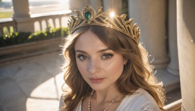 1girl,solo,long hair,looking at viewer,smile,brown hair,dress,brown eyes,jewelry,closed mouth,collarbone,earrings,outdoors,day,necklace,blurry,lips,depth of field,blurry background,sunlight,tiara,crown,portrait,freckles,realistic,nose,princess,bangs,eyelashes,wavy hair,gem,backlighting,pillar