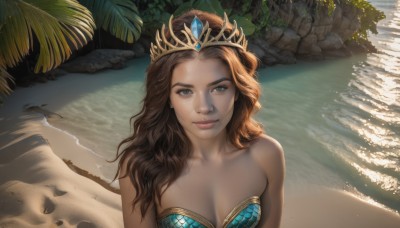 1girl,solo,long hair,breasts,looking at viewer,smile,brown hair,cleavage,bare shoulders,brown eyes,medium breasts,closed mouth,collarbone,swimsuit,upper body,outdoors,day,dark skin,water,dark-skinned female,tree,lips,strapless,ocean,beach,sunlight,tiara,crown,plant,rock,realistic,nose,sand,palm tree,shore,bikini