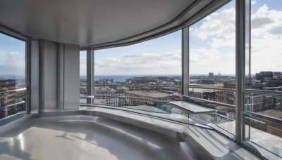 outdoors,sky,day,cloud,indoors,water,blue sky,no humans,window,shadow,ocean,cloudy sky,building,scenery,reflection,city,railing,horizon,cityscape,skyscraper,rooftop,skyline,reflective floor