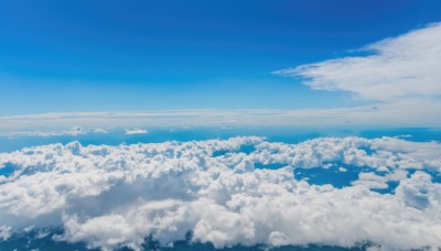 monochrome,outdoors,sky,day,cloud,water,blue sky,no humans,ocean,cloudy sky,scenery,blue theme,city,horizon,cityscape,landscape,above clouds,nature