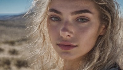 1girl,solo,long hair,looking at viewer,smile,blonde hair,brown eyes,closed mouth,outdoors,sky,day,blurry,blue sky,lips,grey eyes,eyelashes,depth of field,blurry background,wavy hair,thick eyebrows,portrait,close-up,realistic,nose,brown hair,green eyes,wind,messy hair