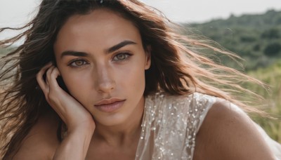 1girl,solo,long hair,looking at viewer,brown hair,black hair,dress,brown eyes,closed mouth,upper body,outdoors,sleeveless,day,blurry,lips,floating hair,depth of field,blurry background,wind,portrait,hand on own face,freckles,head rest,realistic,nose,close-up