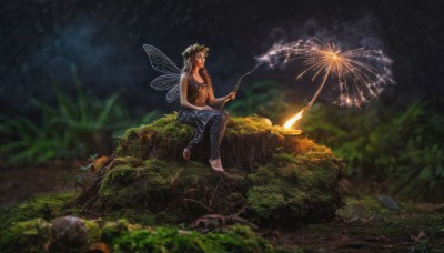 1girl,solo,long hair,breasts,navel,holding,cleavage,bare shoulders,sitting,outdoors,wings,barefoot,pointy ears,blurry,tree,night,depth of field,grass,fire,plant,nature,night sky,rock,fairy wings,fairy,head wreath,fireworks,stick,log,sparkler,campfire,brown hair,hat,pants,tattoo,tank top,scenery,realistic,sitting on rock