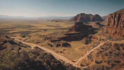 outdoors,sky,day,tree,blue sky,no humans,grass,nature,scenery,forest,mountain,field,landscape,mountainous horizon,desert,water,rock,sand,horizon,shore,cliff