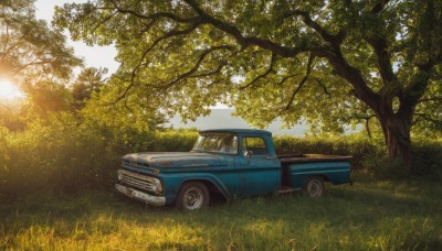 outdoors,sky,day,tree,no humans,sunlight,grass,ground vehicle,nature,scenery,motor vehicle,lens flare,forest,sun,car,vehicle focus,sports car