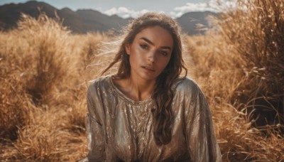 1girl,solo,long hair,looking at viewer,brown hair,black hair,long sleeves,dress,brown eyes,jewelry,upper body,earrings,outdoors,parted lips,sky,teeth,day,blurry,lips,wet,head tilt,blurry background,freckles,realistic,field,breasts,open mouth,blue eyes,medium breasts,upper teeth only,thick eyebrows,curly hair,mountain,wheat