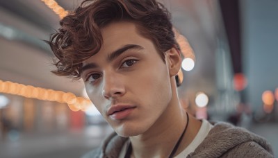 solo,looking at viewer,short hair,brown hair,shirt,1boy,brown eyes,jewelry,closed mouth,jacket,white shirt,male focus,parted lips,necklace,blurry,lips,depth of field,blurry background,facial hair,portrait,realistic,nose,stubble,bangs,outdoors,night,thick eyebrows,rope,brown jacket