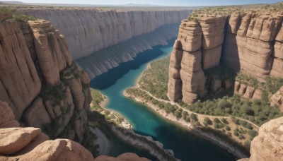 outdoors,sky,day,water,tree,no humans,ocean,nature,scenery,forest,rock,mountain,river,waterfall,landscape,lake,cliff,cave,blue sky,beach,sand,shore