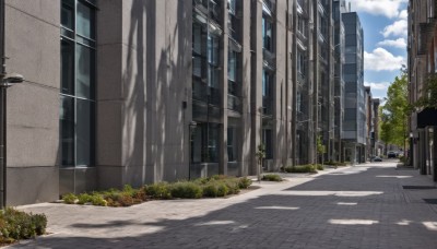 outdoors,sky,day,cloud,tree,blue sky,no humans,window,shadow,sunlight,cloudy sky,plant,building,scenery,city,sign,road,bush,cityscape,shade,lamppost,street,skyscraper,utility pole,crosswalk,sidewalk