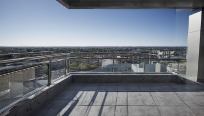 outdoors,sky,day,cloud,blue sky,no humans,window,shadow,building,scenery,city,railing,road,cityscape,bridge,street,skyscraper,rooftop,real world location,water,fence,river