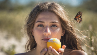 1girl, solo, long hair, looking at viewer, brown hair, holding, mole, blurry, lips, fingernails, depth of field, blurry background, bug, butterfly, portrait, mole under mouth, ball, freckles, realistic, mole on cheek