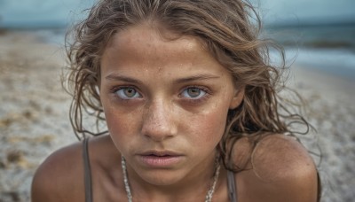 1girl,solo,long hair,looking at viewer,brown hair,bare shoulders,brown eyes,jewelry,closed mouth,outdoors,dark skin,necklace,blurry,dark-skinned female,lips,blurry background,beach,messy hair,portrait,forehead,freckles,realistic,day,close-up,dirty