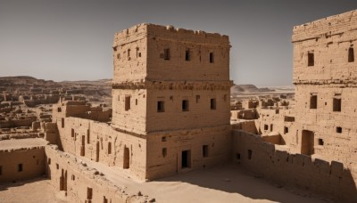 outdoors,sky,day,cloud,no humans,window,building,scenery,snow,mountain,city,sand,road,cityscape,desert,blue sky,wall,architecture,ruins,castle,tower