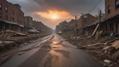 outdoors,sky,cloud,tree,no humans,window,sunlight,cloudy sky,grass,ground vehicle,building,scenery,motor vehicle,sunset,city,fence,sun,car,road,ruins,house,power lines,street,utility pole,orange sky,rock,broken,bare tree,evening