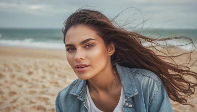 1girl,solo,long hair,looking at viewer,smile,brown hair,shirt,brown eyes,jewelry,jacket,white shirt,upper body,outdoors,parted lips,sky,day,necklace,blurry,lips,floating hair,blurry background,ocean,beach,denim,blue jacket,wind,forehead,realistic,nose,sand,denim jacket,teeth,cloud,water,depth of field,jeans