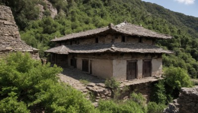 outdoors,sky,day,tree,no humans,grass,building,nature,scenery,forest,bush,wall,architecture,house,path,stone wall,cloud,blue sky,window,rock,mountain,stone