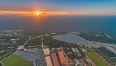 outdoors,sky,cloud,water,tree,no humans,ocean,sunlight,building,nature,scenery,sunset,mountain,city,sun,horizon,road,cityscape,river,landscape,shore,hill,beach,forest,town,real world location