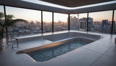 outdoors,sky,cloud,indoors,water,tree,no humans,window,plant,building,scenery,reflection,sunset,city,tiles,pool,potted plant,cityscape,tile floor,bathroom,bathtub,skyscraper,tile wall,sink,skyline,chair,palm tree