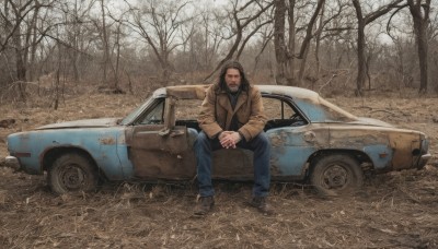 solo,brown hair,long sleeves,1boy,sitting,jacket,male focus,outdoors,shoes,pants,tree,coat,facial hair,own hands together,denim,ground vehicle,nature,motor vehicle,beard,forest,brown jacket,jeans,realistic,car,vehicle focus,bare tree,sports car,on vehicle,looking at viewer,black hair,mustache