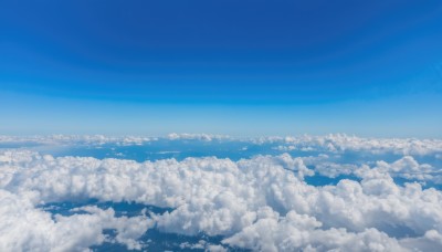 monochrome,outdoors,sky,day,cloud,blue sky,no humans,ocean,cloudy sky,scenery,blue theme,horizon,cityscape,landscape,above clouds,city