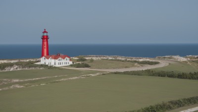 outdoors,sky,day,water,blue sky,no humans,ocean,beach,grass,building,scenery,horizon,river,castle,tower,landscape,shore,tree,nature,forest,road,field,path,lighthouse