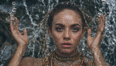 1girl,solo,looking at viewer,blue eyes,brown hair,black hair,hair ornament,holding,jewelry,upper body,parted lips,dark skin,water,necklace,blurry,dark-skinned female,lips,wet,hands up,blurry background,portrait,forehead,water drop,rock,realistic,wet hair,straight-on,very dark skin,dreadlocks,choker,black eyes,chain,gold,gold chain