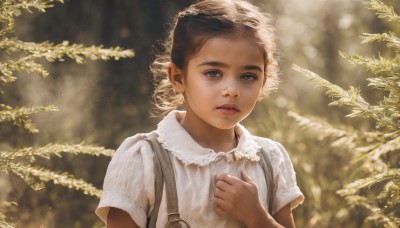 1girl,solo,looking at viewer,short hair,brown hair,shirt,green eyes,white shirt,upper body,short sleeves,parted lips,collared shirt,hand up,signature,dark skin,blurry,lips,depth of field,blurry background,suspenders,hand on own chest,child,curly hair,realistic,nose,branch,brown eyes,outdoors,leaf,sunlight,nature,forest,dappled sunlight