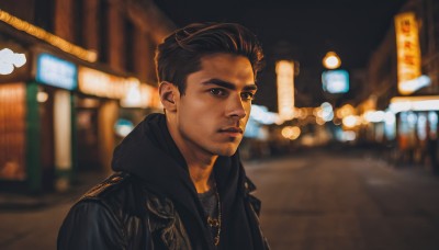 solo,looking at viewer,short hair,brown hair,shirt,black hair,1boy,brown eyes,jewelry,jacket,upper body,male focus,outdoors,dark skin,necklace,blurry,black eyes,black jacket,night,depth of field,blurry background,dark-skinned male,realistic,undercut,leather jacket,photo background,closed mouth,parted lips,open jacket,facial hair,thick eyebrows,stubble,road,leather