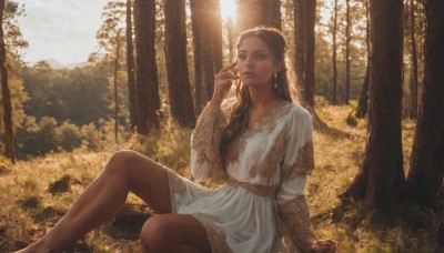 1girl,solo,long hair,blue eyes,brown hair,black hair,long sleeves,dress,brown eyes,jewelry,sitting,closed mouth,earrings,outdoors,barefoot,day,hand up,dark skin,white dress,dark-skinned female,tree,lips,dutch angle,eyelashes,feet out of frame,arm support,looking away,sunlight,grass,nature,scenery,forehead,forest,arm at side,knee up,light rays,realistic,sun,looking afar,on ground,looking at viewer,braid,parted lips,hair over shoulder,brown gloves,hoop earrings