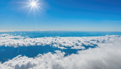 monochrome,outdoors,sky,day,cloud,water,blue sky,no humans,ocean,sunlight,cloudy sky,scenery,blue theme,sun,horizon,landscape,above clouds,light rays