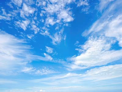 dress,monochrome,outdoors,sky,day,cloud,blue sky,no humans,ocean,cloudy sky,scenery,flying,blue theme,horizon,above clouds