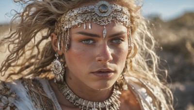 1girl,solo,long hair,looking at viewer,blue eyes,blonde hair,brown hair,jewelry,closed mouth,earrings,outdoors,day,dark skin,necklace,mole,blurry,lips,grey eyes,floating hair,depth of field,blurry background,wavy hair,portrait,freckles,curly hair,circlet,realistic,nose,mole on cheek,sky,wind,mole under mouth,close-up