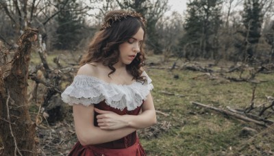 1girl,solo,long hair,brown hair,dress,bare shoulders,closed mouth,closed eyes,upper body,outdoors,day,off shoulder,blurry,tree,lips,wavy hair,crossed arms,red dress,tiara,crown,nature,lace,forest,curly hair,realistic,photo background