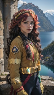 1girl,solo,long hair,looking at viewer,brown hair,black hair,hair ornament,gloves,long sleeves,brown eyes,jewelry,standing,braid,flower,red hair,multicolored hair,cowboy shot,outdoors,sky,day,belt,pants,cloud,water,necklace,blurry,two-tone hair,blue sky,lips,makeup,blurry background,tiara,lipstick,gem,pendant,freckles,curly hair,realistic,nose,arms at sides,multiple braids,bangs,closed mouth,earrings,twin braids,grey eyes,wavy hair,black pants,sunlight,yellow shirt,rock,mountain,blue pants,lake