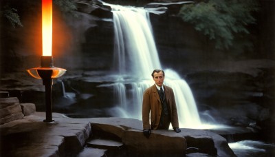 HQ,solo,black hair,gloves,1boy,male focus,necktie,black gloves,water,tree,coat,facial hair,parody,formal,suit,scenery,mustache,waterfall,trench coat,cave,looking at viewer,shirt,jacket,outdoors,brown jacket,rock