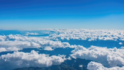 monochrome,outdoors,sky,day,cloud,water,blue sky,no humans,ocean,cloudy sky,building,nature,scenery,blue theme,mountain,horizon,landscape,bird