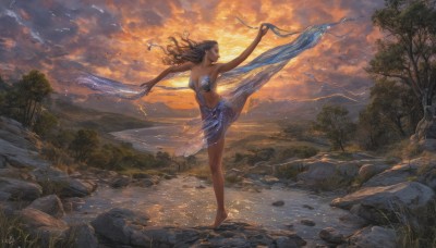 1girl,solo,long hair,breasts,brown hair,black hair,bare shoulders,medium breasts,standing,outdoors,sky,barefoot,cloud,signature,dark skin,water,dark-skinned female,tree,see-through,bird,leg up,standing on one leg,cloudy sky,grass,outstretched arms,nature,scenery,forest,sunset,rock,realistic,fantasy,dancing,river,lake,balancing,navel,cleavage