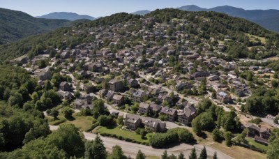 outdoors,sky,day,tree,blue sky,no humans,building,nature,scenery,forest,mountain,city,road,cityscape,house,river,landscape,mountainous horizon,hill,town